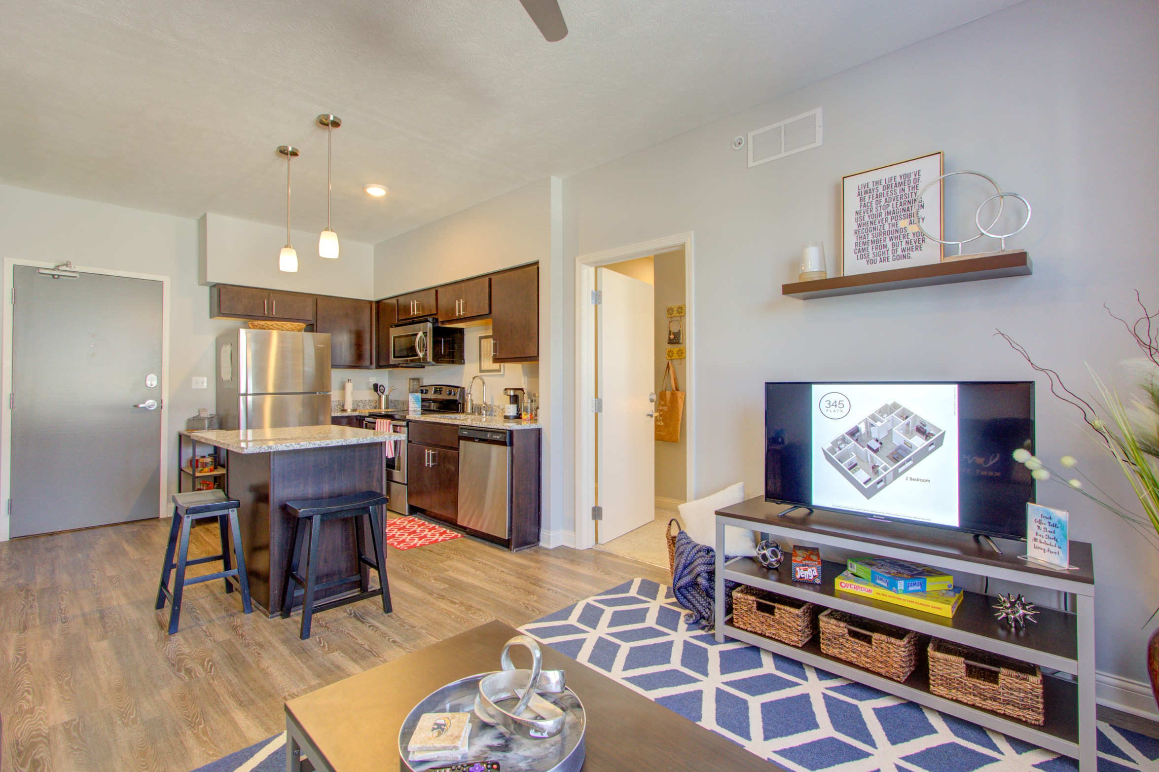 Living room and kitchen of a model apartment at 345 Flats