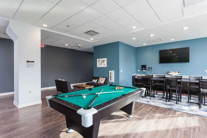 Resident lounge with kitchen and pool table